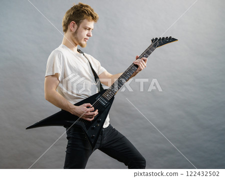 Man playing on electric guitar 122432502