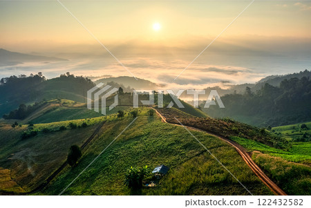 Sunrise over hill with vegetable and foggy in countryside 122432582