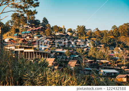 Rustic traditional village on hillside of local community in the valley on countryside 122432588