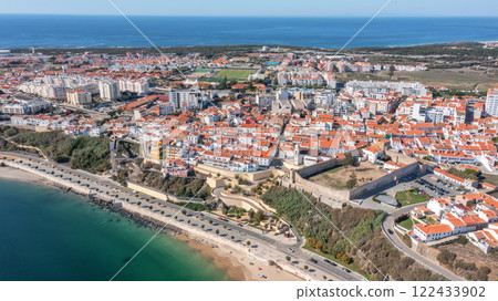 Aerial panorama of city of Sines, Alentejo Portugal Europe. Aerial view of old fishing port, historic center and castle.  122433902