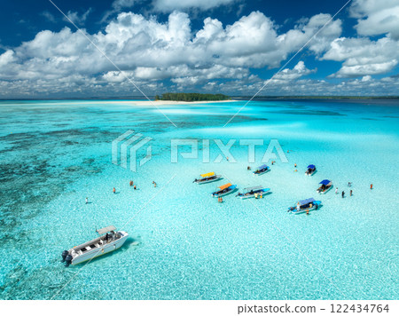 Aerial view of colorful boats and yachts in transparent water Aerial view of colorful boats and yachts in transparent water 122434764