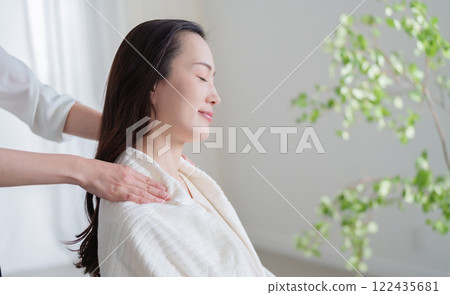 Woman getting a shoulder massage Woman getting a shoulder massage 122435681