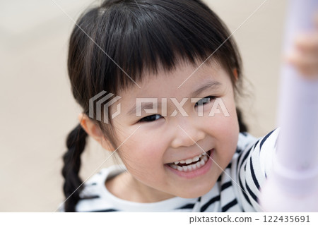 Smiling child looking at camera 122435691