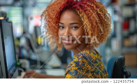 Portrait of a young woman with red curly hair smiling at the camera 122435754