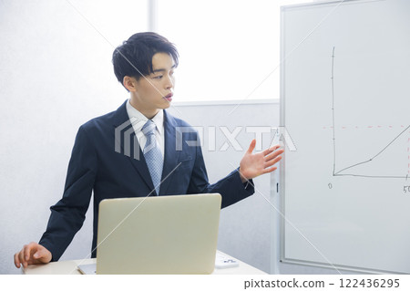 Young businessman presenting Young businessman presenting 122436295