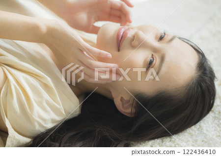 Beauty image of a woman lying on her back Beauty image of a woman lying on her back 122436410