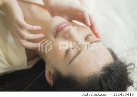 Beauty image of a woman lying on her back Beauty image of a woman lying on her back 122436419