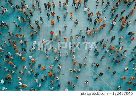 A crowd of people are walking on a sidewalk. top view 122437040
