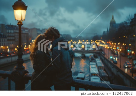 A couple is kissing on a bridge over a river A couple is kissing on a bridge over a river 122437062