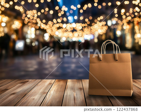 Brown Paper Bag on Wooden Table with Blurred Festive Lights 122437868