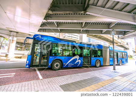 Yokohama cityscape in Japan. View of the Bayside Blue (out-of-service train) departing from the east exit of Yokohama Station (center) (January 2025) 122439801