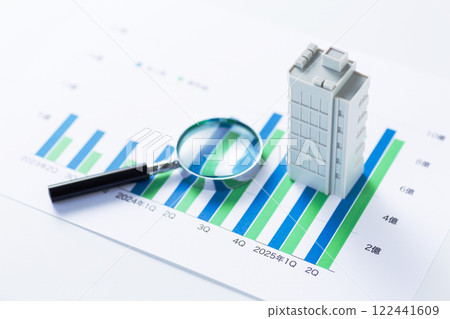 Company performance graph, corporate building and magnifying glass Company performance graph, corporate building and magnifying glass 122441609