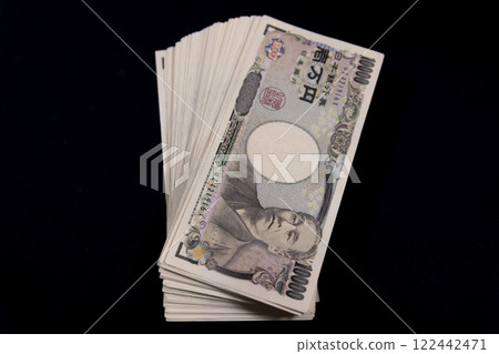100 old 10,000 yen bills on a black background 100 old 10,000 yen bills on a black background 122442471