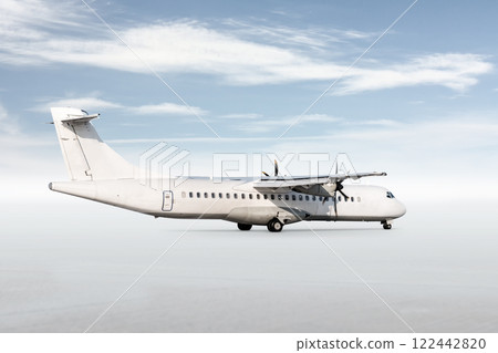 White passenger turboprop airplane isolated on bright background with sky 122442820