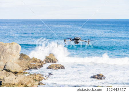 A drone flying over the coast 122442857