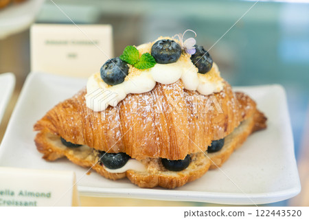 profiteroles with cream and berries 122443520