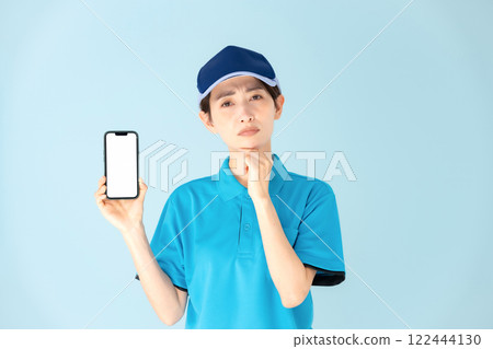 Woman delivery smartphone worries Woman delivery smartphone worries 122444130