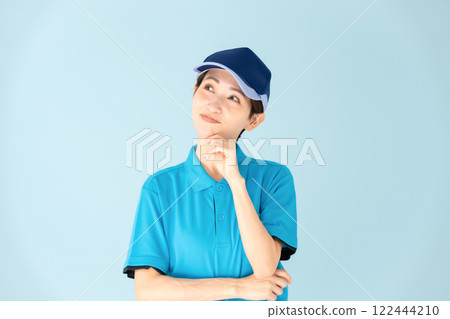 Woman, home delivery, thinking, smiling Woman, home delivery, thinking, smiling 122444210