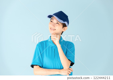 Woman, home delivery, thinking, smiling Woman, home delivery, thinking, smiling 122444211