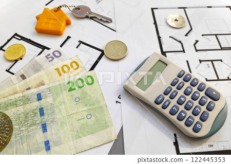 Danish krone banknotes on the top of building plans Danish krone banknotes on the top of building plans 122445353