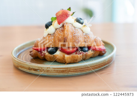 Fresh Strawberry and Blueberry Cream Croissant on a Rustic Ceramic Plate Fresh Strawberry and Blueberry Cream Croissant on a Rustic Ceramic Plate 122445973