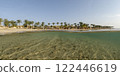 Resort view sandy beach with palm trees and underwater bottom 122446619