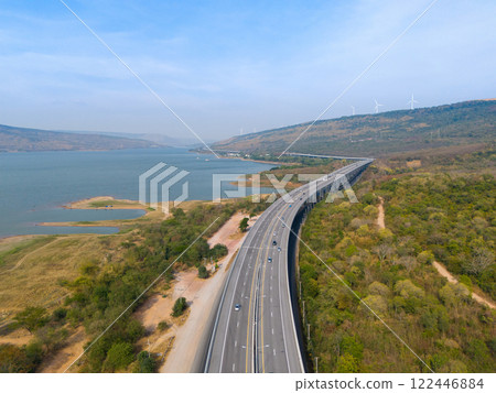 The M6 motorway Expressway Nakhon Ratchasima Province - Bang Pa-in. Lam Ta Khong River and Mountain. Drone shot of scenic landscape rural place traffic. Nakhon Ratchasima Thailand. Motorway Korat The M6 motorway Expressway Nakhon Ratchasima Province - Bang Pa-in. Lam Ta Khong River and Mountain. Drone shot of scenic landscape rural place traffic. Nakhon Ratchasima Thailand. Motorway Korat 122446884