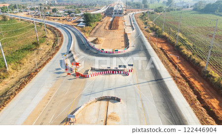 Drone shot aerial view of high angle view of a construction site building intersection across the bridge Drone shot aerial view of high angle view of a construction site building intersection across the bridge 122446904