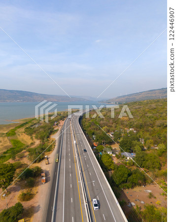 The M6 motorway Expressway Nakhon Ratchasima Province - Bang Pa-in. Lam Ta Khong River and Mountain. Drone shot of scenic landscape rural place traffic. Nakhon Ratchasima Thailand. Motorway Korat The M6 motorway Expressway Nakhon Ratchasima Province - Bang Pa-in. Lam Ta Khong River and Mountain. Drone shot of scenic landscape rural place traffic. Nakhon Ratchasima Thailand. Motorway Korat 122446907