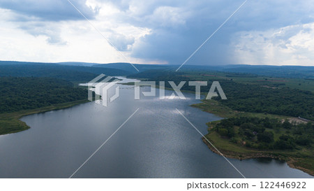Drone shot. Aerial view scenic landscape of a large river delta amid a lush forest at the tropical Asia place 122446922