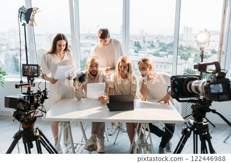 Team script. Media brainstorm. People working creative project in studio. Video shooting art collaboration model photographer director. 122446988