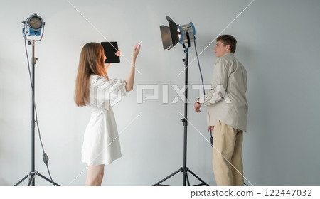 Prepare spotlight. Studio lamp. Media team adjust level direction lighting shooting. Professional equipment for video recording photography. Prepare spotlight. Studio lamp. Media team adjust level direction lighting shooting. Professional equipment for video recording photography. 122447032