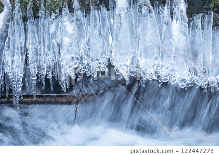 Icicles in a clear stream in the forest, Oku-Daisen 122447273