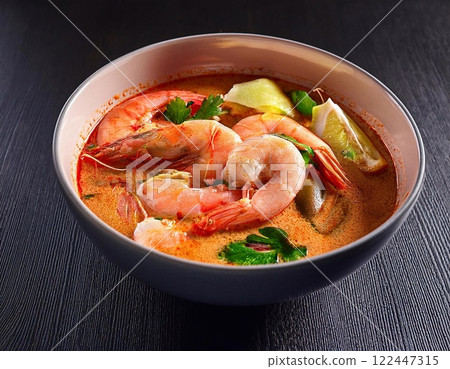 Tom yam is a spicy clear soup typical in Thailand and No. 1 Thai Dish Cuisine. 122447315