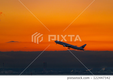 Jet plane taking off into the morning sky 122447342