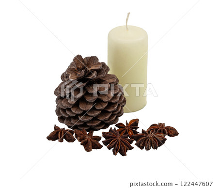 Natural brown pine cone, fragrant badian (star anise) and light candle on a clean without background. Minimalistic still life. For holiday cards, winter and Christmas decor. Natural brown pine cone, fragrant badian (star anise) and light candle on a clean without background. Minimalistic still life. For holiday cards, winter and Christmas decor. 122447607
