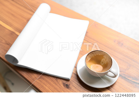 Open Blank Book and Cappuccino on Wooden Table in Cozy Cafe Open Blank Book and Cappuccino on Wooden Table in Cozy Cafe 122448095