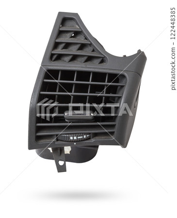 A close-up view of a part of the interior of a modern car with a view of the ventilation deflector of the heater for heating and cooling the passenger compartment. Used auto part catalog from junkyard A close-up view of a part of the interior of a modern car with a view of the ventilation deflector of the heater for heating and cooling the passenger compartment. Used auto part catalog from junkyard 122448385