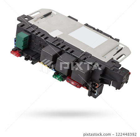Fuse box and black relay in the car's electrical circuit during vehicle repair in the workshop. Auto service industry. Fuse box and black relay in the car's electrical circuit during vehicle repair in the workshop. Auto service industry. 122448392