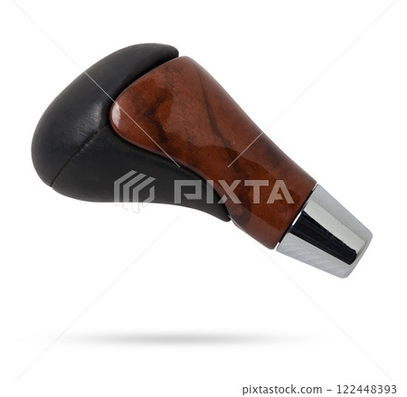 Wooden and leather handle for shifting automatic gears of the car. Decorative details on a black background. 122448393