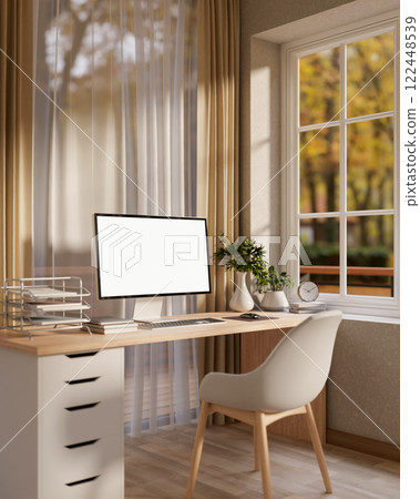 A beautiful, contemporary office or home office features a computer and decor on a desk. A beautiful, contemporary office or home office features a computer and decor on a desk. 122448539