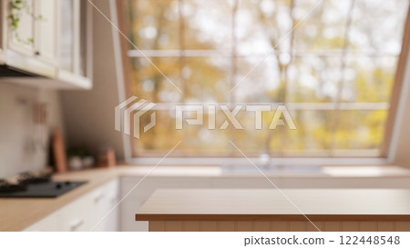A minimal hardwood kitchen island, set in a contemporary kitchen featuring a large starlight window. A minimal hardwood kitchen island, set in a contemporary kitchen featuring a large starlight window. 122448548