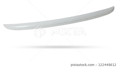 Black plastic spoiler for installation on the trunk lid of a car for tuning on a white isolated background in a photo studio at auto-analysis. Sporty design in the workshop 122448612