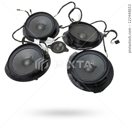 Two speakers of an acoustic system - an audio for playing music in a car interior on a white isolated background in a photo studio. Spare parts for auto repair in a workshop or for sale for tuning Two speakers of an acoustic system - an audio for playing music in a car interior on a white isolated background in a photo studio. Spare parts for auto repair in a workshop or for sale for tuning 122448653