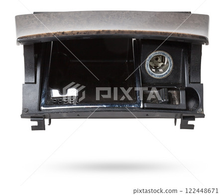 An opened ashtray from panel of car interior separately on a white isolated background with wooden decorative overlay. An opened ashtray from panel of car interior separately on a white isolated background with wooden decorative overlay. 122448671
