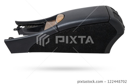 Plastic element of car interior is covered in black leather - armrest or a glove compartment - spare part with air conditioning holes on a white background. Catalog for site. Plastic element of car interior is covered in black leather - armrest or a glove compartment - spare part with air conditioning holes on a white background. Catalog for site. 122448702