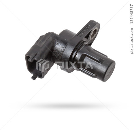Electromagnetic crankshaft position sensor of a car engine in the hands of an auto mechanic. Spare parts catalog. Electromagnetic crankshaft position sensor of a car engine in the hands of an auto mechanic. Spare parts catalog. 122448787