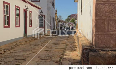 Walking through colorful cobblestone street in colonial Brazilian town Walking through colorful cobblestone street in colonial Brazilian town 122449367