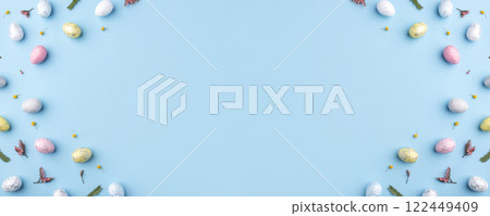 Easter frame of eggs painted in blue color. 122449409