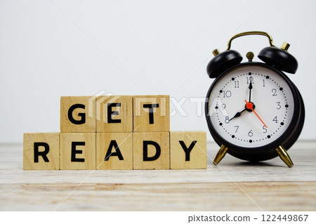 Time to Get Ready with wooden blocks alphabet letters and alarm clock on wooden background Time to Get Ready with wooden blocks alphabet letters and alarm clock on wooden background 122449867